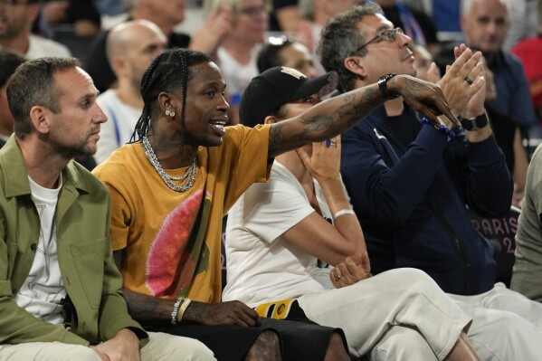 Travis Scott watches the France vs' Germany game during a men's semifinals basketball game at Bercy Arena at the 2024 Summer Olympics, Thursday, Aug. 8, 2024, in Paris, France. (AP Photo/Mark J. Terrill)