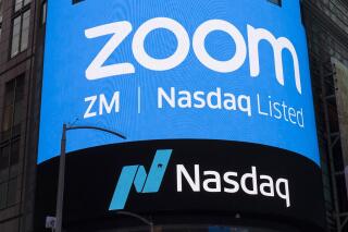 FILE - This April 18, 2019, file photo shows a sign for Zoom Video Communications ahead of their Nasdaq IPO in New York. Zoom is still booming, raising prospects that the video-conferencing service will be able to sustain its momentum, even as the easing pandemic lessens the need for virtual meetings. Some signs for optimism emerged in the company’s latest quarterly earnings report released Tuesday, June 1, 2021, fueling a modest rally in the company's recently slumping stock. (AP Photo/Mark Lennihan, File)