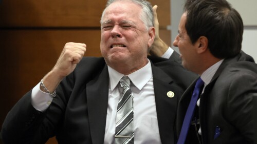 Former Marjory Stoneman Douglas High School School Resource Officer Scot Peterson reacts as he is found not guilty on all charges at the Broward County Courthouse in Fort Lauderdale, Fla., on Thursday, June 29, 2023. Peterson was acquitted of child neglect and other charges for failing to act during the Parkland school massacre, where 14 students and three staff members were murdered. (Amy Beth Bennett/South Florida Sun-Sentinel via AP, Pool)