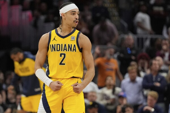 Indiana Pacers guard Andrew Nembhard celebrates after scoring during the second half in Game 5 of an Eastern Conference semifinal NBA basketball playoff against the Cleveland Cavaliers, Tuesday, May 13, 2025, in Cleveland. (AP Photo/Sue Ogrocki)