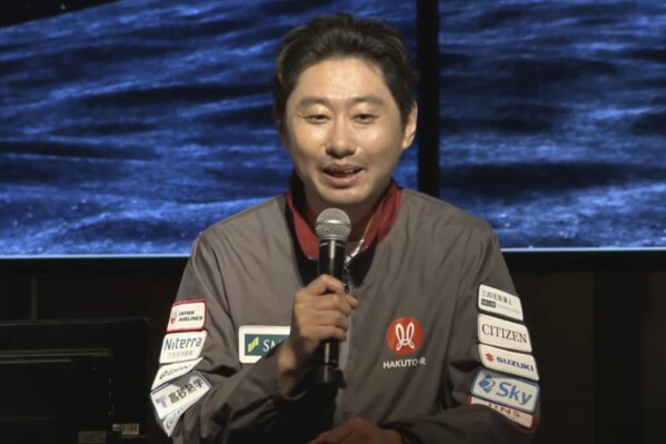 This image taken from video shows ispace CEO and founder Takeshi Hakamada speaking before a private lunar lander attempt on the moon Friday, June 6, 2025. (ispace via AP)