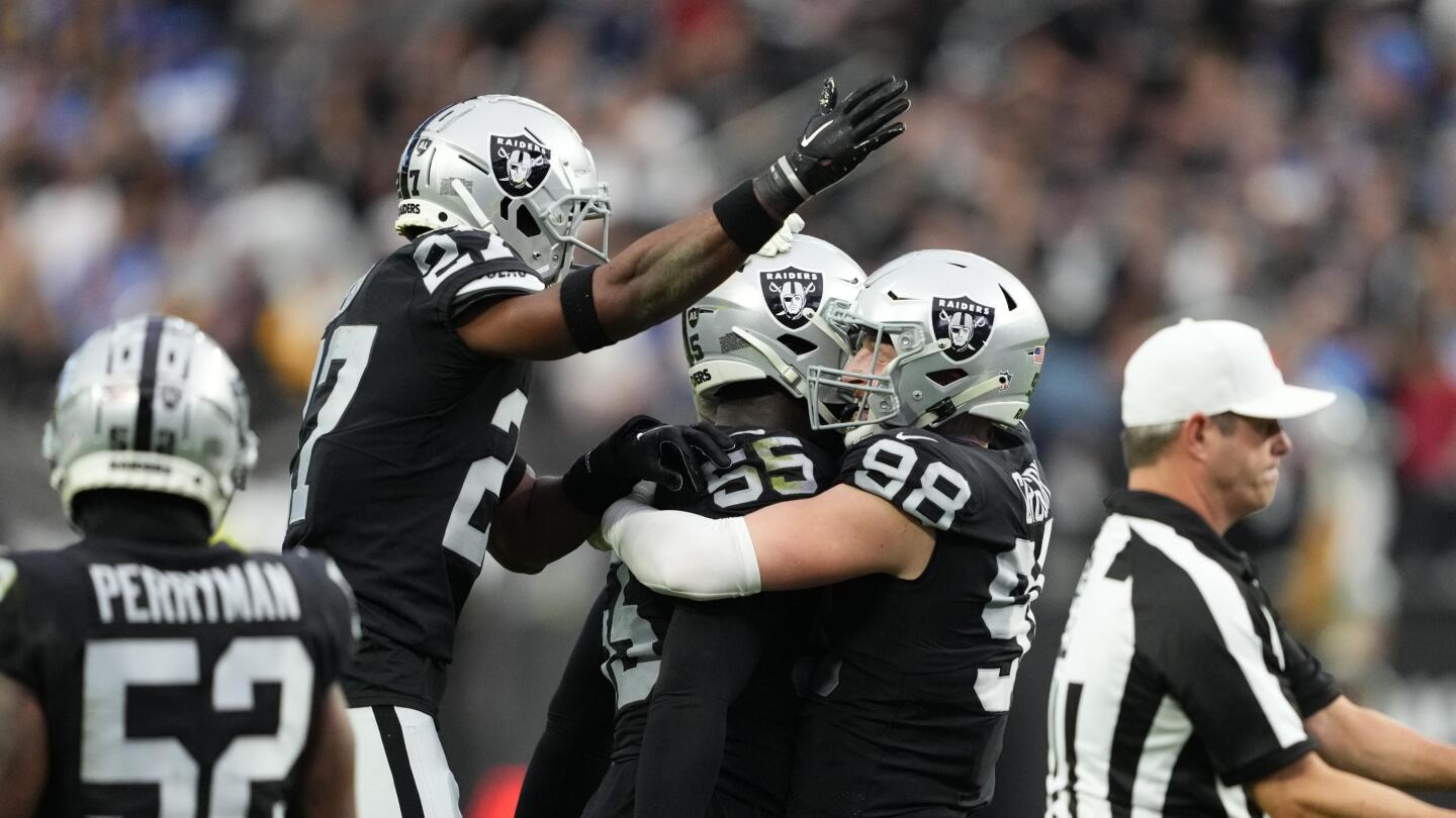 Las Vegas Raiders defensive end Maxx Crosby (98) celebrates after blocking  a field goal attempt …