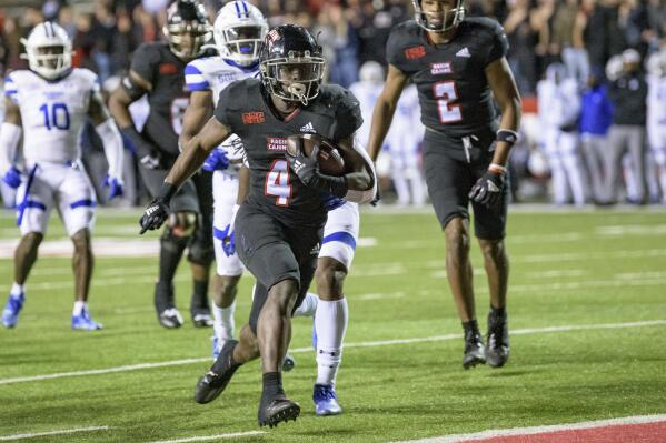 Louisiana-Lafayette running back Montrell Johnson (4) scores a touchdown during the second half of the team's NCAA college football game against Georgia State in Lafayette, La., Thursday, Nov. 4, 2021. (AP Photo/Matthew Hinton)