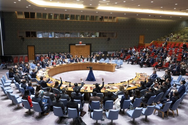 In this photo provided by the United Nations, members of the UN Security Council vote to approve its first resolution endorsing a cease-fire plan aimed at ending the eight-month war between Israel and Hamas in Gaza, Monday, June 10, 2024. (Eskinder Debebe/United Nations via AP)