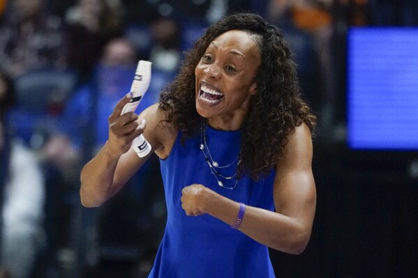 FILE - Kentucky head coach Kyra Elzy directs her players in a NCAA college basketball game against Tennessee, March 5, 2022, in Nashville, Tenn. On Monday, June 10, 2024, Duke women's basketball coach Kara Lawson hired Elzy as an assistant, reuniting the former Tennessee teammates on the Blue Devils’ staff. (AP Photo/Mark Humphrey, File)