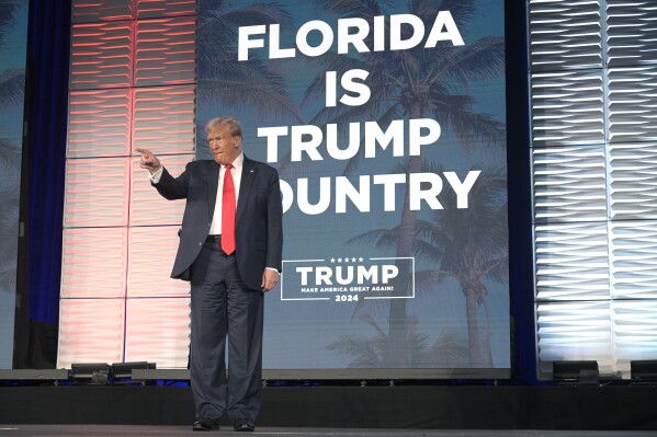 Former President Donald Trump acknowledges attendees before speaking at the Republican Party of Florida Freedom Summit, Saturday, Nov. 4, 2023, in Kissimmee, Fla. (AP Photo/Phelan M. Ebenhack)