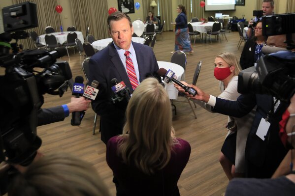 Kris Kobach, a candidate for the Republican nomination for U.S. Senate. talks with reporters at his primary watch party in Leavenworth, Kan., Tuesday, Aug. 4, 2020. (AP Photo/Orlin Wagner)