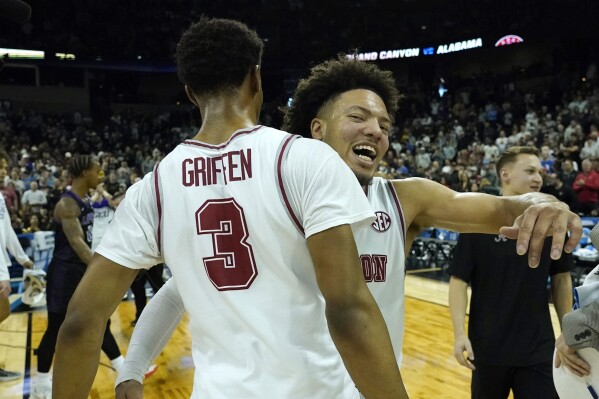Alabama guard Mark Sears, right, celebrates with guard Rylan Griffen (3) after Alabama beat Grand Canyon in a second-round college basketball game in the NCAA Tournament in Spokane, Wash., Sunday, March 24, 2024. (AP Photo/Ted S. Warren)