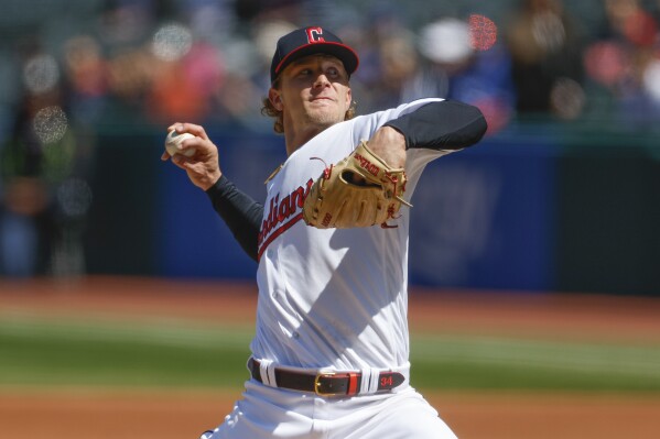 FILE -Cleveland Guardians starting pitcher Zach Plesac delivers against the Seattle Mariners during the first inning of a baseball game, Sunday, April 9, 2023, in Cleveland. Right-hander Zach Plesac and the Los Angeles Angels finalized a $1 million, one-year contract on Saturday. Jan. 6, 2024. (AP Photo/Ron Schwane, File)