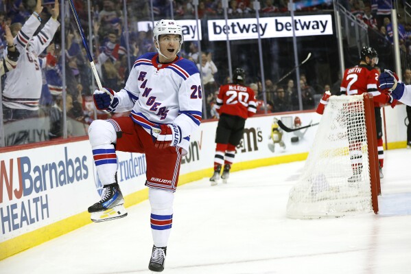 New York Rangers left wing Jimmy Vesey (26) celebrates after scoring a goal against the New Jersey Devils during the first period of an NHL hockey game Saturday, Nov. 18, 2023, in Newark, N.J. (AP Photo/Noah K. Murray)