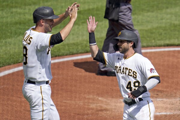 Pittsburgh Pirates starting pitcher JT Brubaker, left, tags out