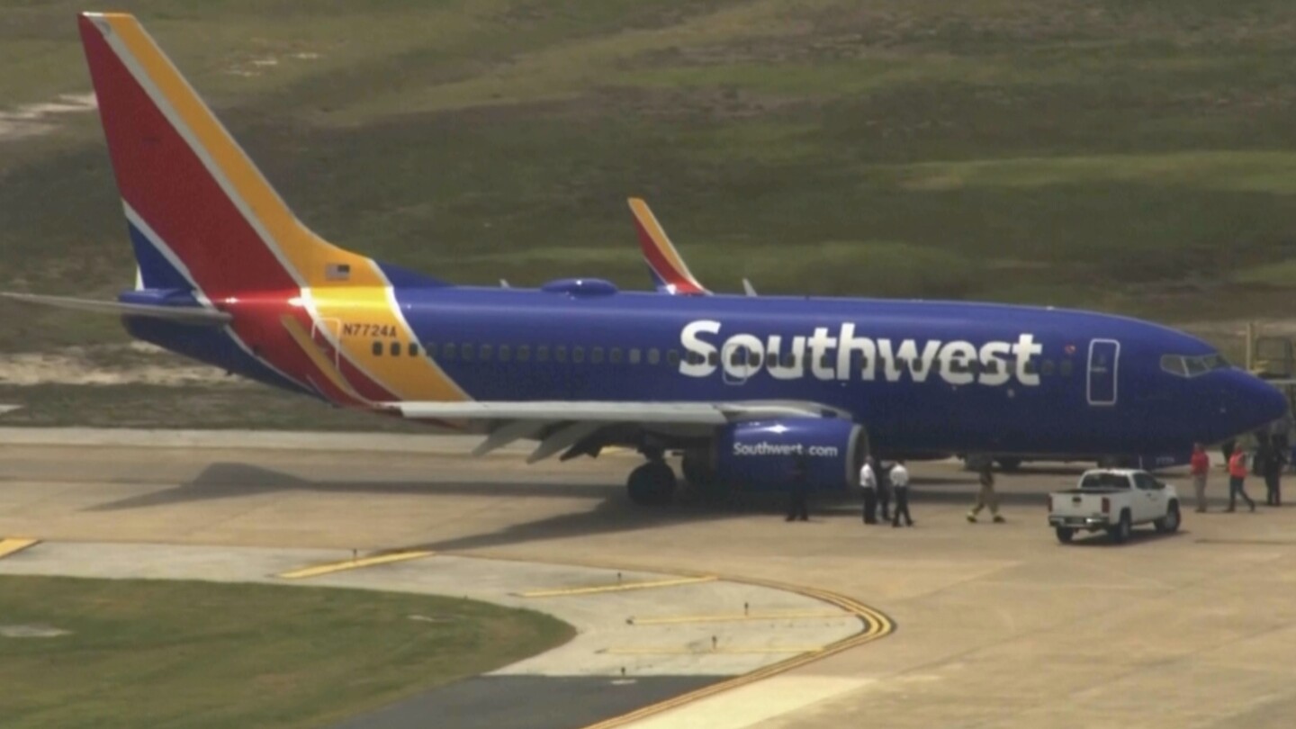 Passengers on Southwest flight evacuated after engine fire forces plane's return