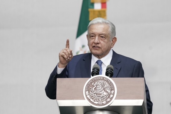 FILE - Mexico's President Andres Manuel Lopez Obrador speaks during a rally marking his fifth anniversary in office, at the Zocalo in Mexico City on July 1, 2023. Mexico’s armed forces sent troops, vehicle convoys and helicopters into remote towns near the southern border with Guatemala on Wednesday, Sept. 27, after drug cartels blocked roads and cut off electricity in some areas over the weekend. Lopez Obrador acknowledged Monday that the cartels have cut off electricity in some towns and forbidden government workers from coming in to the largely rural area to fix the power lines. (AP Photo/Aurea Del Rosario, File)