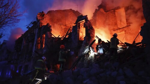 In this image taken from video provided by the Ukrainian Emergency Service, emergency services work at a scene of destroyed residential area after a Russian attack in Mykolaiv, Ukraine, Thursday, July 20, 2023. (Ukrainian Emergency Service via AP)