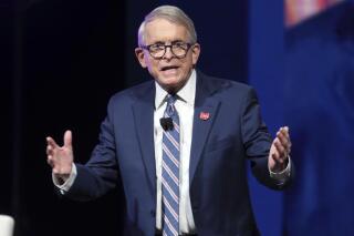 Ohio Gov. Mike DeWine speaks Jan. 21, 2022 in Newark, Ohio. Gov. DeWine has signed a bill into law protecting athletes' religious expression. The bill was inspired by an Ohio teen disqualified from a cross-country race for wearing a hijab without a required waiver. The measure signed by DeWine Monday, Feb. 28, 2022 prohibits school sports regulators from requiring advance waivers or otherwise restricting participants' religious apparel unless it causes a “legitimate danger." (AP Photo/Paul Vernon, file)