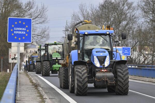 Czech farmers in tractors make their way to the Hodon铆n/Hol铆膷, Czech-Slovakia border crossing, in Czech Republic, Thursday, Feb. 22, 2024, to meet their colleagues from neighboring countries and join forces in their protests against European Union agriculture policies, bureaucracy and overall conditions for their business. (Vaclav Salek/CTK via 番茄直播)