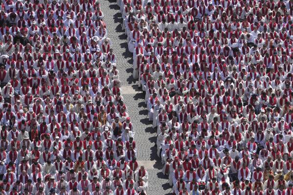 Clergy follow the funeral of Pope Francis in St. Peter's Square at the Vatican, Saturday, April 26, 2025. (AP Photo/Alessandra Tarantino)