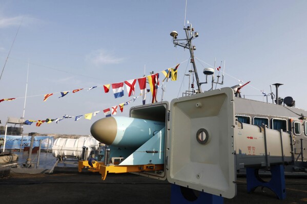 In this picture released by the official website of the Iranian Army on Sunday, Dec. 24, 2023, a missile system is displayed in an unveiling ceremony at a naval base near the Indian Ocean in the southern Iranian port of Konarak, some 850 miles (1,400 kilometres) southeast of the capital, Tehran, Iran. Iran's navy on Sunday added domestically produced sophisticated cruise missiles to its arsenal, state TV reported. (Iranian Army via AP)
