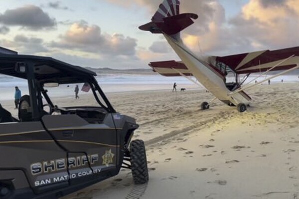 In this photo provided by the San Mateo County Sheriff's Office, is a stolen plane that crashed on the beach in Half Moon Bay, Calif., Thursday, Feb. 8, 2024. Deputies located and arrested a man matching the description of a person seen landing the plane and walking away, police said. A 50-year-old Miami man was charged with theft of the airplane believed to have been stolen from an airport in Palo Alto, Calif. (San Mateo County Sheriff's Office via AP)