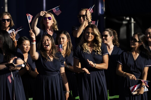 Solheim Cup team US clap during the opening ceremony of the Solheim Cup in Marbella, southern Spain, on Thursday, Sept. 21, 2023. (AP Photo/Bernat Armangue)