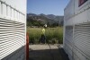 A worker lays cables at Energy Vault, a company that is creating an emergency power system that relies on hydrogen and battery storage, on Tuesday, May 27, 2025, in Calistoga, Calif. (AP Photo/Annika Hammerschlag)