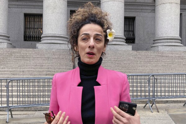 FILE - Masih Alinejad, is interviewed outside Manhattan federal court, April 7, 2023, in New York. The Justice Department says a suspect in a plot to kill an Iranian American author and activist has been extradited from the Czech Republic to face charges. Polad Omarov was arrested by Czech officials in January 2023, when charges were announced against him and two other men in the alleged plot to kill Alinejad, an Iranian opposition activist who has spoken out against human rights abuses there. (APPhoto/Lawrence Neumeister, File)
