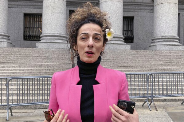 FILE - Masih Alinejad, is interviewed outside Manhattan federal court, April 7, 2023, in New York. The Justice Department says a suspect in a plot to kill an Iranian American author and activist has been extradited from the Czech Republic to face charges. Polad Omarov was arrested by Czech officials in January 2023, when charges were announced against him and two other men in the alleged plot to kill Alinejad, an Iranian opposition activist who has spoken out against human rights abuses there. (AP Photo/Lawrence Neumeister, File)