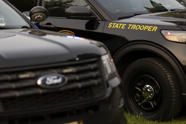 Maryland State Trooper cars appear on display during National Night Out, Tuesday, August 1, 2023, in Salisbury, Md. The event, hosted by the Salisbury Police Department, aims to promote stronger community relationships and includes a number of organizations that provide support services to families. (AP Photo/Julia Nikhinson)