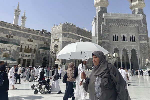 Muslim pilgrims enter the Grand Mosque, during the annual Hajj pilgrimage in Mecca, Saudi Arabia, Monday, June 2, 2025. (AP Photo/Amr Nabil)