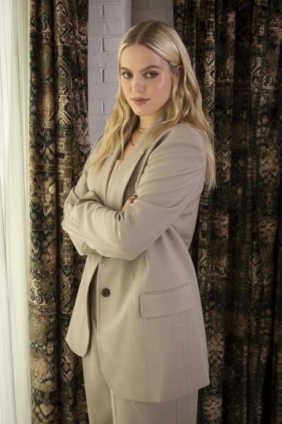 Renee Rapp poses for a portrait on Tuesday, Nov. 2, 2021, in New York.  Rapp, former star in Broadway’s “Mean Girls” as Regina George, makes her TV debut in the new series “The Sex Lives of College Girls” for HBO Max. The series, produced by Mindy Kaling, debuts Nov. 18. (Photo by Andy Kropa/Invision/AP)