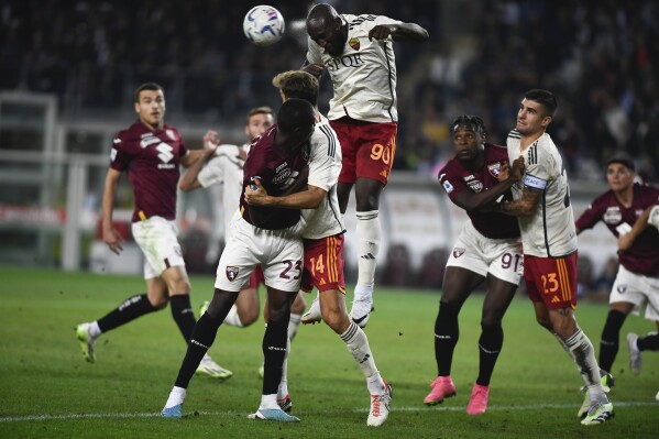 Romelu Lukaku of AS Roma heads the ball during a Serie A soccer match between Torino and Roma at the Olympic stadium in Turin, Italy on Sunday, Sept. 24, 2023. (Fabio Ferrari/LaPresse via AP)