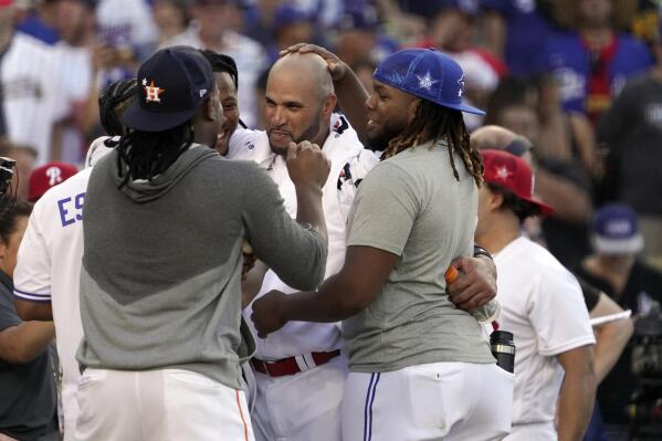 National League's Albert Pujols, of the St. Louis Cardinals, celebrates with fellow players at the end of his round during the MLB All-Star baseball Home Run Derby, Monday, July 18, 2022, in Los Angeles. (AP Photo/Mark J. Terrill)