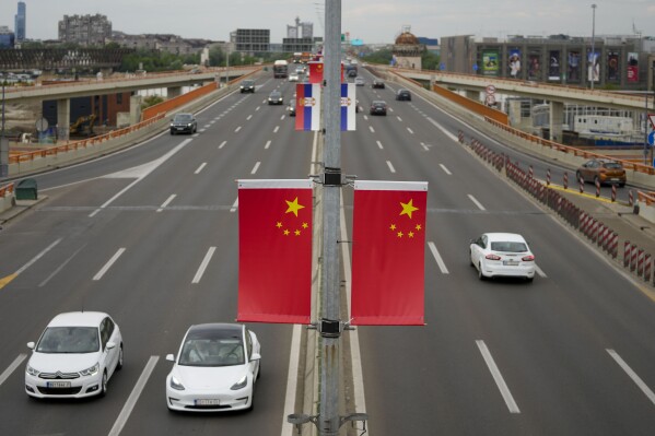 Chinese and Serbian flags fly on lampposts, days before the visit of Chinese President Xi Jinping in Belgrade, Serbia, Wednesday, May 1, 2024. Xi will visit France, Serbia and Hungary this week as Beijing appears to seek a larger role in the conflict between Russia and Ukraine that has upended global political and economic security. (AP Photo/Darko Vojinovic)