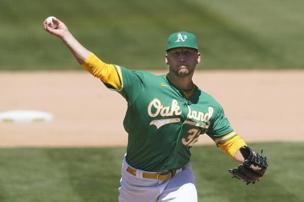 Oakland Athletics' James Kaprielian pitches against the Seattle Mariners during the seventh inning of a baseball game in Oakland, Calif., Wednesday, May 26, 2021. (AP Photo/Jeff Chiu)