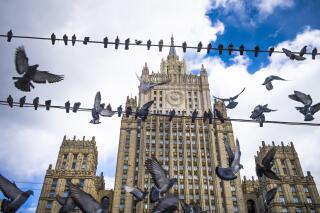 FILE Pigeons take off from wires in front of the Russian Foreign Ministry building, in Moscow, Russia, Thursday, March 29, 2018. Senior diplomats from Russia, Turkey, Syria and Iran on Tuesday, April 4, 2023 have wrapped up two days of talks in Moscow, part of the Kremlin's efforts to help broker a rapprochement between the Turkish and Syrian governments. (AP Photo/Alexander Zemlianichenko, File)