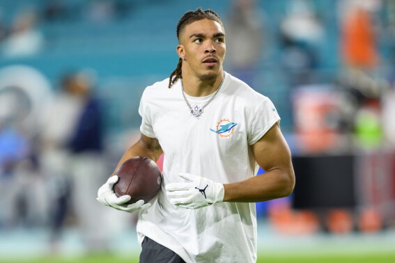 FILE - Miami Dolphins wide receiver Chase Claypool (83) warms up on the field before the start of an NFL football game against the Tennessee Titans, Monday, Dec. 12, 2023, in Miami Gardens, Fla. The Buffalo Bills announced the signings of Claypool, defensive end Dawuane Smoot and linebacker Deion Jones to one-year contracts on Friday, May 3, 2024. (AP Photo/Doug Murray, File)