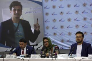FILE - Hawa Alam Nuristani, chief of Election Commission of Afghanistan, center, speaks during a press conference at the Independent Election Commission office in Kabul, Afghanistan, Feb. 18, 2020. The Taliban dissolved Afghanistan's Independent Election Commission and Electoral Complaint Commission as well as the state ministries for peace and parliamentarian affairs, an official said Sunday, Dec. 26, 2021. (AP Photo/Rahmat Gul, File)