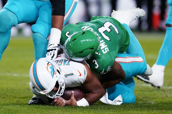 Philadelphia Eagles linebacker Nolan Smith (3) sacks Miami Dolphins quarterback Tua Tagovailoa (1) during the first half of an NFL football game Sunday, Oct. 22, 2023, in Philadelphia. (AP Photo/Chris Szagola)