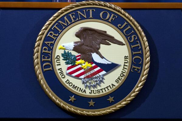 FILE - The Department of Justice seal is seen in Washington, Nov. 28, 2018. President Joe Biden campaigned on a pledge to work toward abolishing federal capital punishment. But his Justice Department continues to press for the death penalty in certain cases — even as a moratorium means no federal executions are likely to happen anytime soon. (AP Photo/Jose Luis Magana, File)