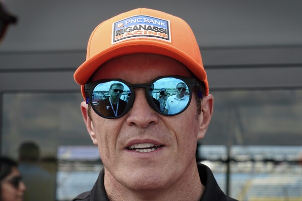 Scott Dixon, of New Zealand, speaks to reporters before practice for an IndyCar Series auto race, Friday, July 21, 2023, at Iowa Speedway in Newton, Iowa. (AP Photo/Charlie Neibergall)