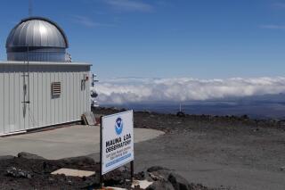 This 2019 photo provided by NOAA shows the Mauna Loa Atmospheric Baseline Observatory, high atop Hawaii's largest mountain in order to sample well-mixed background air free of local pollution. Heat-trapping carbon dioxide levels in the air peaked in May 2021, in amounts nearly 50% higher than when the industrial age began and they are growing at a record fast rate, scientists reported Monday, June 7, 2021. (Susan Cobb/NOAA Global Monitoring Laboratory via AP)