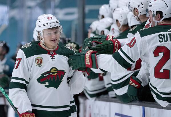 Minnesota Wild's Eric Staal, top, is congratulated by Minnesota