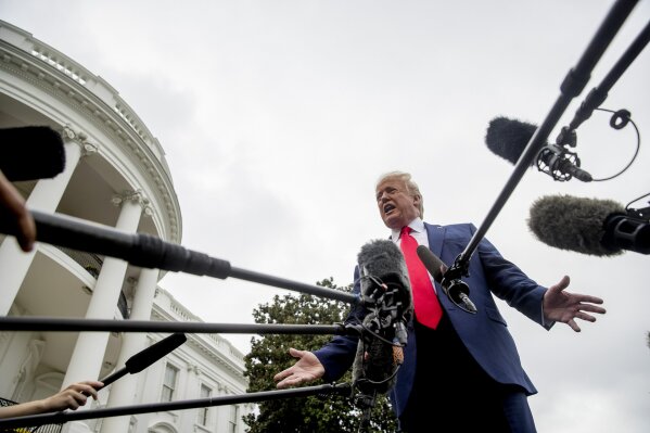 President Donald Trump speaks to the media on the South Lawn of the White House in Washington, Thursday, Oct. 3, 2019, before boarding Marine One for a short trip to Andrews Air Force Base, Md., and then on to Florida. (AP Photo/Andrew Harnik)