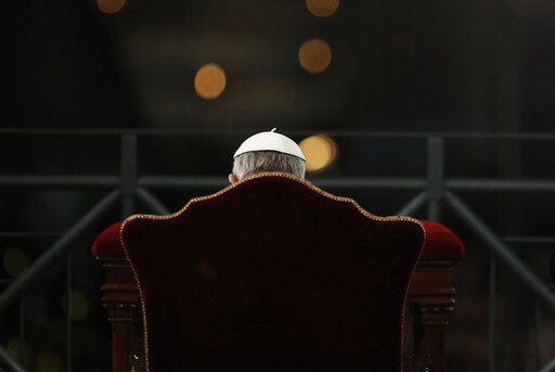 Pope Francis presides the Via Crucis (Way of the Cross) torchlight procession celebrated in front of the Colosseum on Good Friday in Rome, Friday, March 29, 2013. (AP Photo/Andrew Medichini, File)