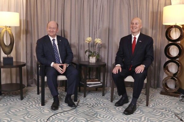 U.S. Senator Pete Ricketts, right, and Chris Coons are interviewed by the Associated Press in Taipei, Taiwan, Thursday, April 17, 2025. (AP Photo/Chiang Ying-ying)