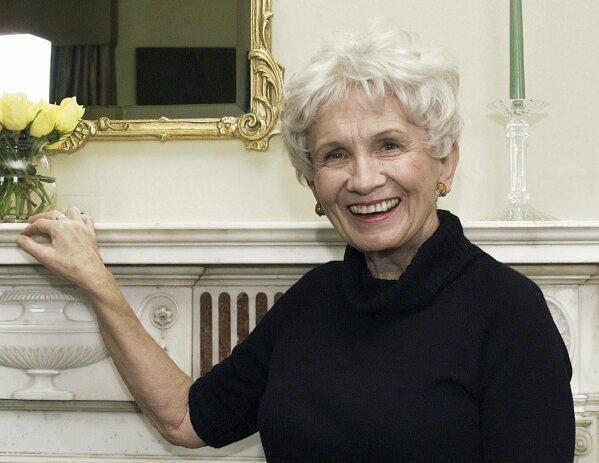 FILE - Canadian author Alice Munro poses for a photograph at the Canadian Consulate's residence in New York on Oct. 28, 2002. Munro, the Canadian literary giant who became one of the world’s most esteemed contemporary authors and one of history's most honored short story writers, has died at age 92. (AP Photo/Paul Hawthorne, File)