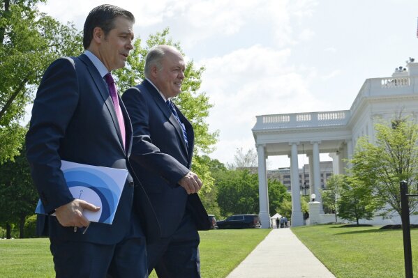FILE - In this May 11, 2018, file photo, Association of Global Automakers President and Chief Executive Officer John Bozzella, left, and Ford Motor Company Chief Executive Officer Jim Hackett, right, arrive for a meeting with President Donald Trump at the White House in Washington. At a board meeting Tuesday, Dec. 1, 2020, the Alliance for Automotive Innovation, a big industry trade association, recognized that change is coming. Alliance CEO John Bozzella said automakers are committed to working with the Biden administration, which will renew the fight against climate change and likely will undo pollution and gas mileage rollbacks made by President Donald Trump.
(AP Photo/Susan Walsh, File)