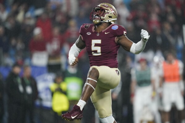 Florida State defensive lineman Jared Verse reacts after a play during the second half of the team's Atlantic Coast Conference championship NCAA college football game against Louisville, Saturday, Dec. 2, 2023, in Charlotte, N.C. (AP Photo/Erik Verduzco)