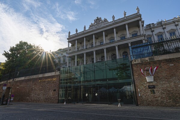 FILE - The sun sets behind the Palais Coburg, where closed-door nuclear talks on the revival of the Joint Comprehensive Plan of Action (JCPOA) take place, in Vienna, Austria, on Aug. 5, 2022. The Western powers in the 2015 nuclear agreement with Iran accused Tehran on Monday, Dec. 18, 2023, of developing and testing ballistic missiles, transferring hundreds of drones to Russia, and enriching uranium to an unprecedented 60% level for a country without a nuclear weapons program — all in violation of a U.N. resolution endorsing the deal. (AP Photo/Florian Schroetter, File)