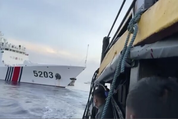 FILE - In this image from a video released by the Armed Forces of the Philippines, Filipino sailors look after a Chinese coast guard ship with bow number 5203 bumps their supply boat as they approach Second Thomas Shoal, locally called Ayungin Shoal, at the disputed South China Sea on Oct. 22, 2023. Chinese and Southeast Asian diplomats renewed a vow to finalize a nonaggression pact for the South China Sea in three years, two regional diplomats said Thursday, Nov. 2, 2023. (Armed Forces of the Philippines via AP)